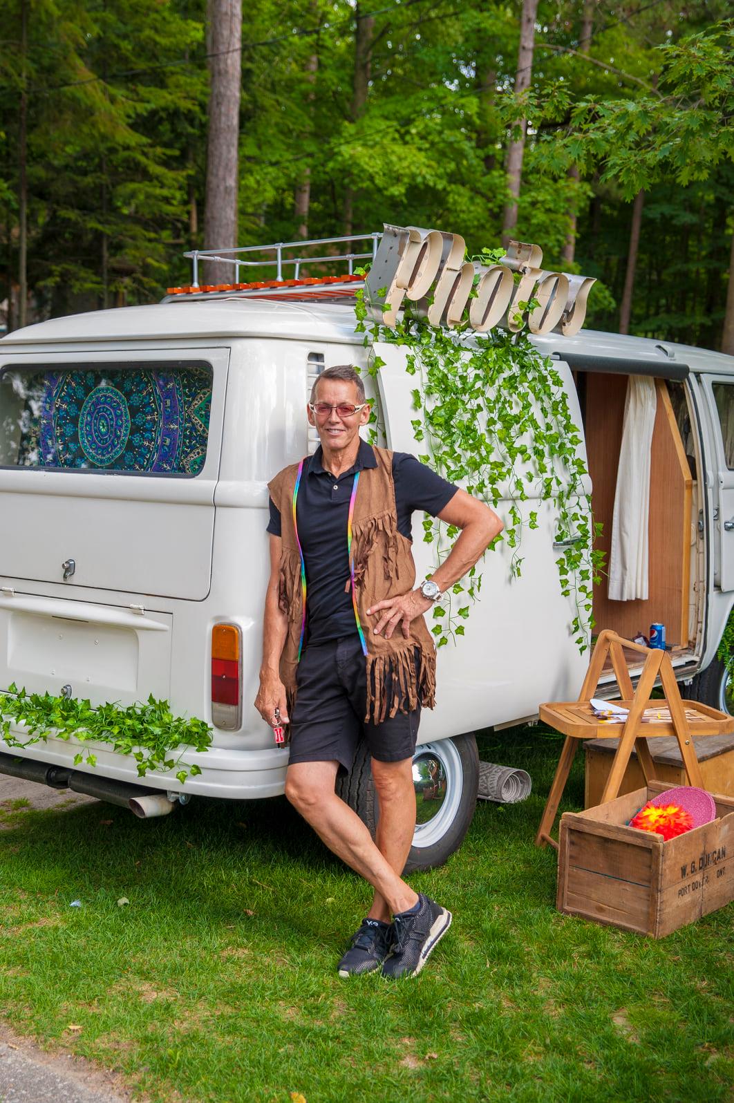 Jai Crouch posing outside of VW van photo booth.