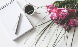 Flowers and coffee on table